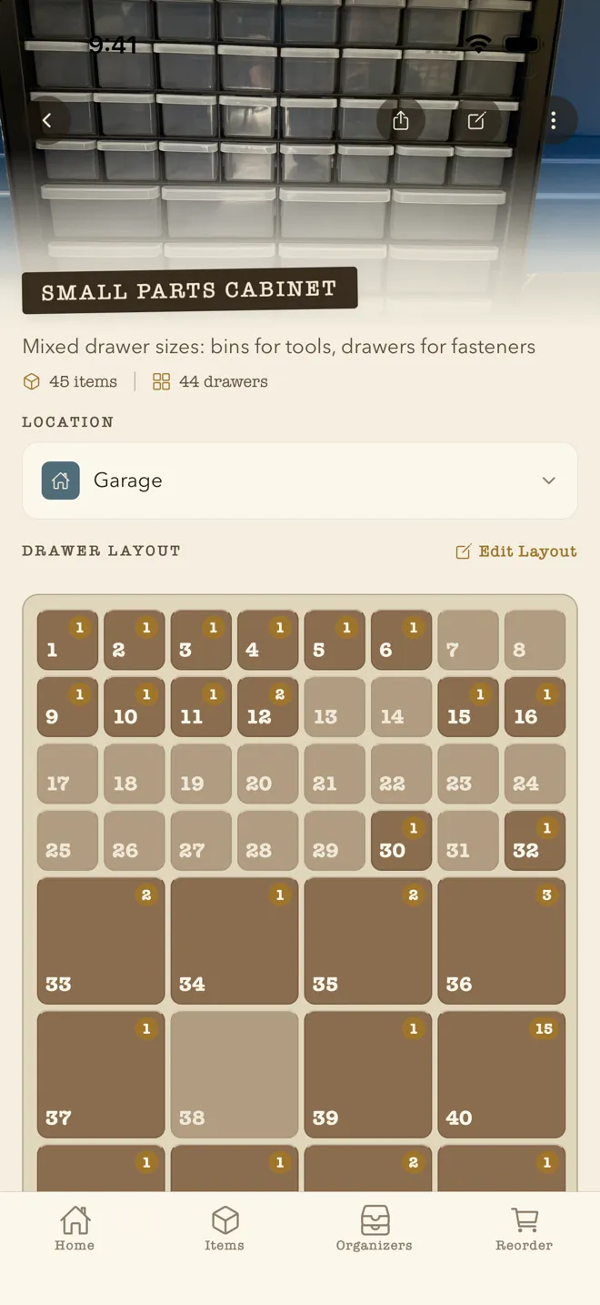 A mixed-size 44-drawer parts cabinet in WhichDrawer: photo of the real cabinet on top, its drawer grid mapped below with item counts per drawer